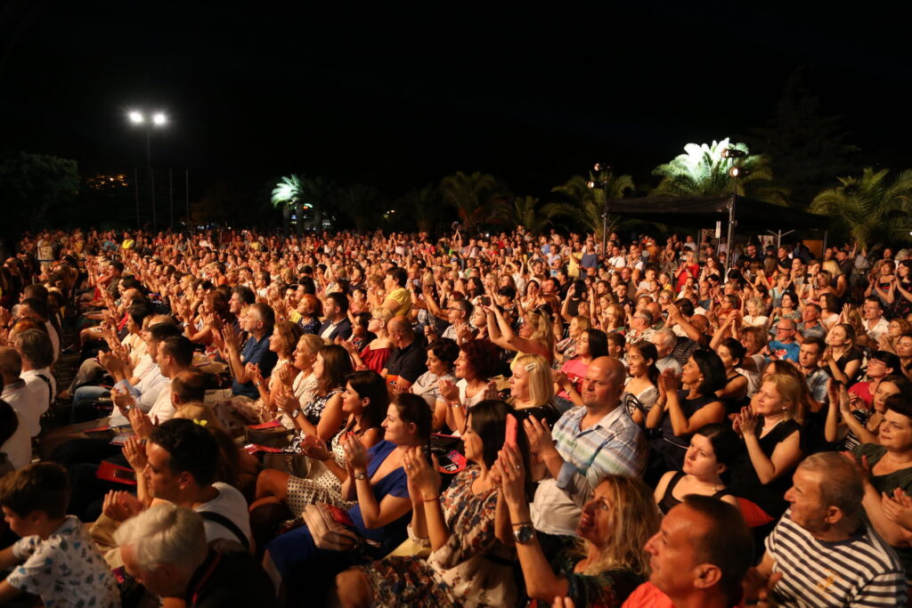 A picture from Bar Chronicle happening on summer stage filled with people